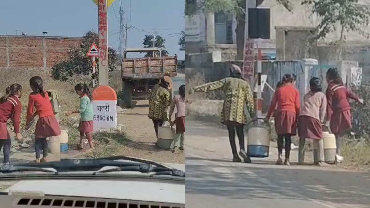 SCHOOL CHILDREN CARRYING WATER