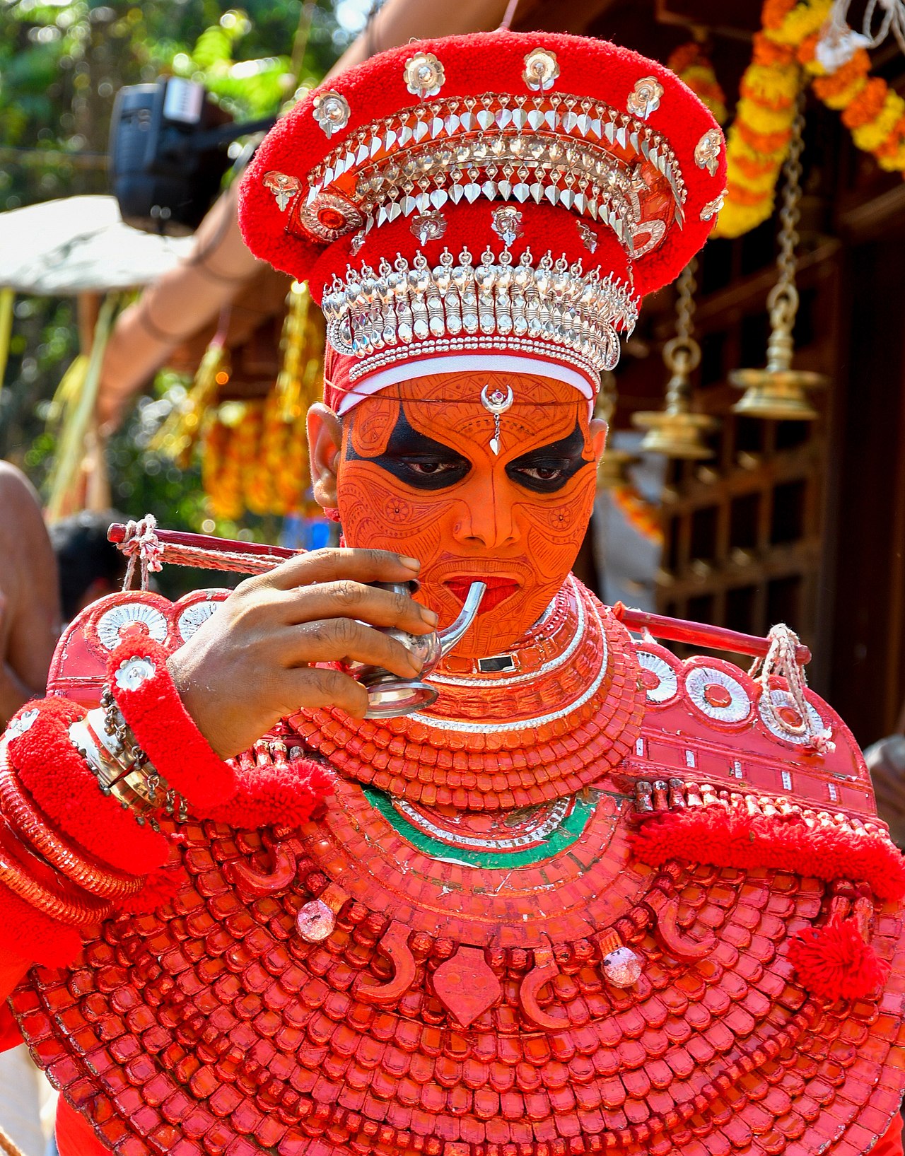 KERALA THEYYAM ART FORM  THEYYAM ART FORM HISTORY  BELIEFS BEHIND THEYYAM  MAKEUP DRESS OF THEYYAM