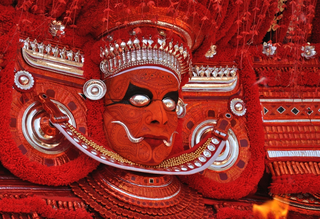 KERALA THEYYAM ART FORM  THEYYAM ART FORM HISTORY  BELIEFS BEHIND THEYYAM  MAKEUP DRESS OF THEYYAM