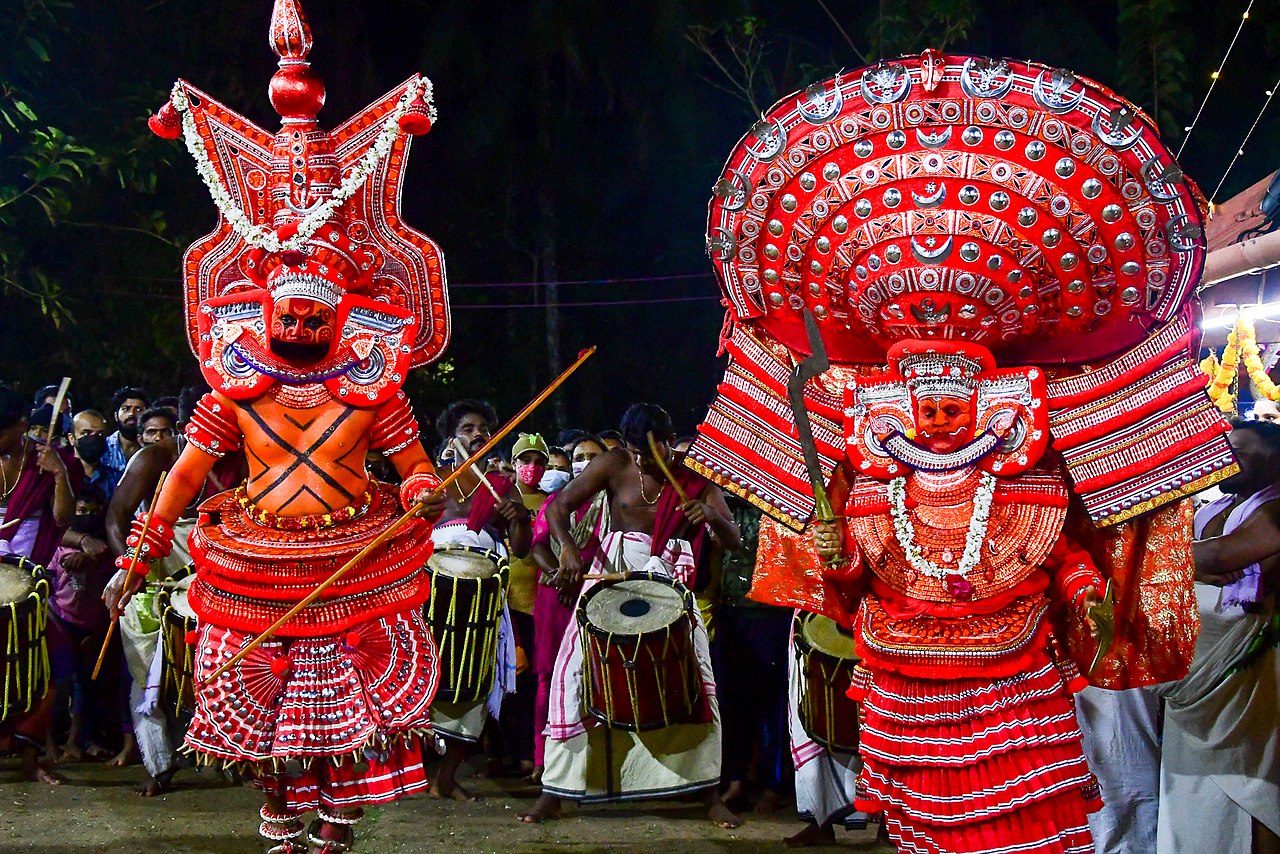 KERALA THEYYAM ART FORM  THEYYAM ART FORM HISTORY  BELIEFS BEHIND THEYYAM  MAKEUP DRESS OF THEYYAM