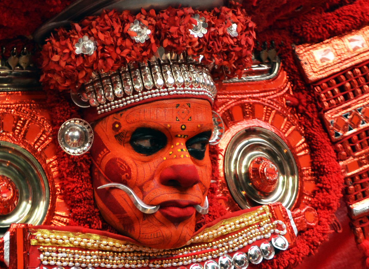 KERALA THEYYAM ART FORM  THEYYAM ART FORM HISTORY  BELIEFS BEHIND THEYYAM  MAKEUP DRESS OF THEYYAM