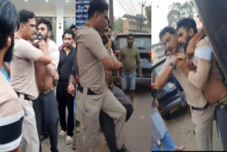 പാര്‍ക്കിങ്ങിനെ ചൊല്ലി തര്‍ക്കം  പൊലീസും യുവാവും തമ്മില്‍ കയ്യാങ്കളി  മലപ്പുറം പാര്‍ക്കിങ്ങ് തര്‍ക്കം  Parking Issue Fight Malappuram  Police and Youth Fight Malappuram