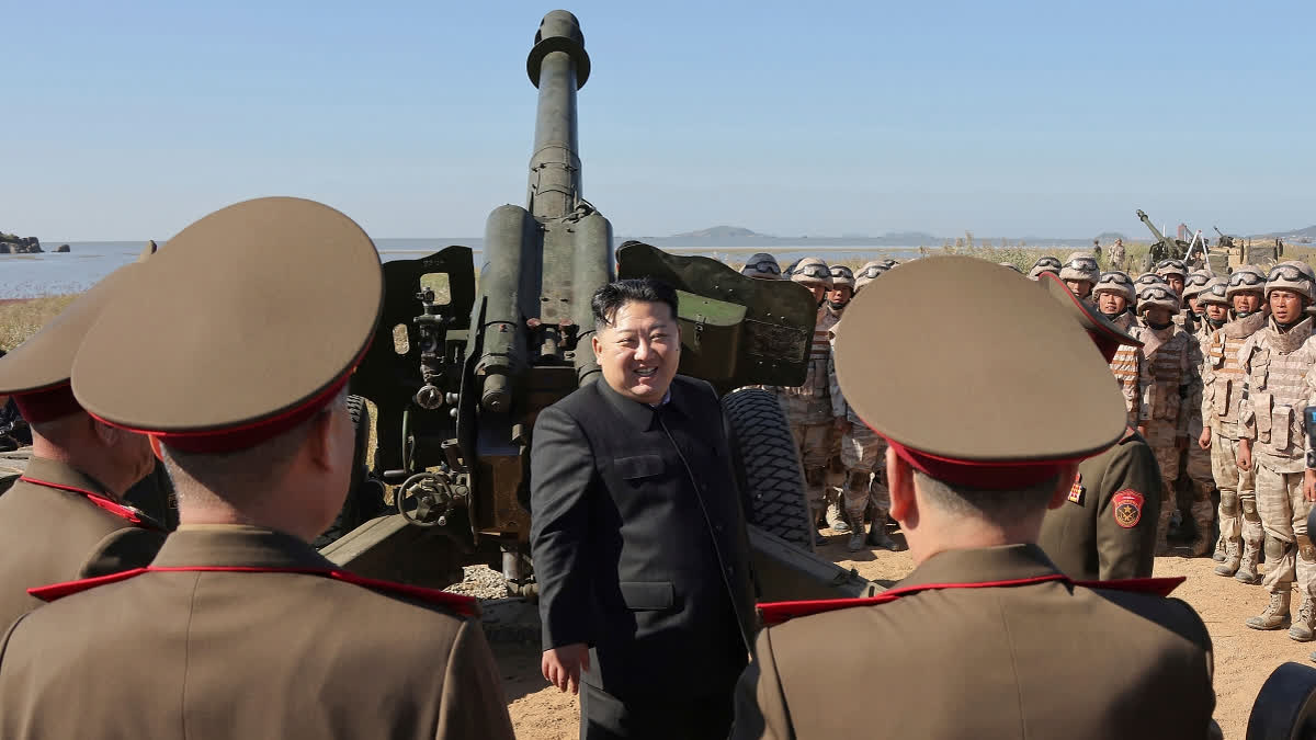 FILE - In this undated photo provided Oct. 6, 2024, by the North Korean government, its leader Kim Jong Un, center, visits an artillery exercise at an undisclosed place in North Korea.