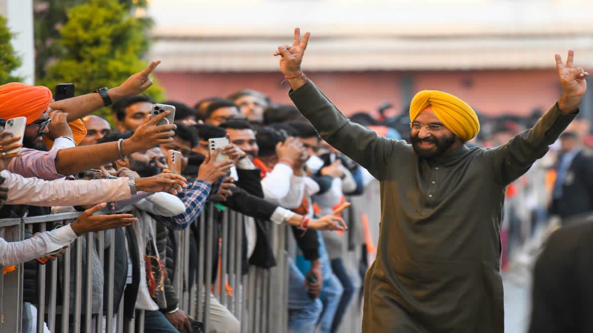 Majinder Singh Sirsa shows victory sign to supporters at the BJP headquartes in New Delhi  after the declaration of results.