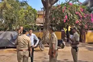 Police conducting an inspection in front of the doctor's house