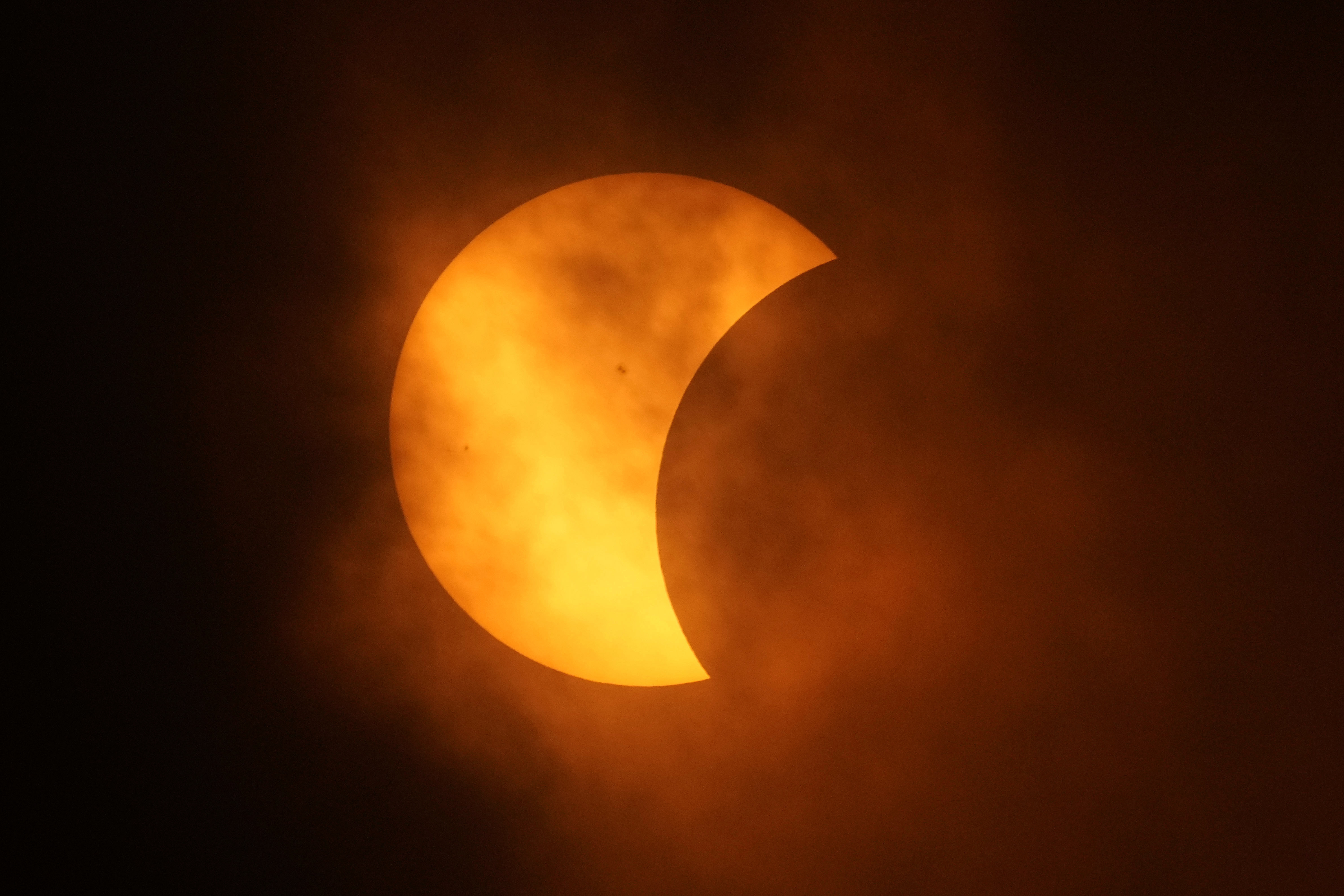 total solar eclipse wows north america clouds part just in time for most