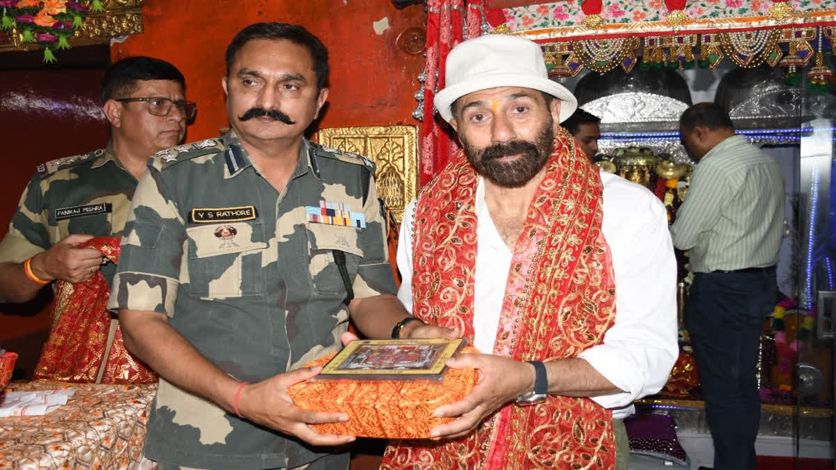 BSF DIG Yogendra Singh paying respects to Sunny at the temple
