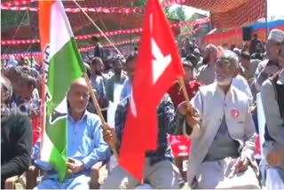 NC and INC workers hold respective party flags at a Lok Sabha election campaign rally in Srinagar