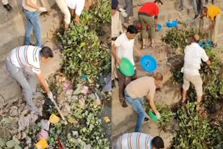 District Collector came down to clean the pond with a shovel