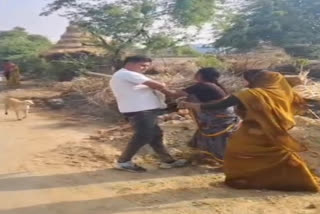 woman scuffles with policeman