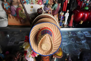 Haiti-decorated hats are displayed for sale among other items, inside 3x3 Santa Barbara Botanica in Miami's Little Haiti neighborhood, Friday, June 6, 2025.