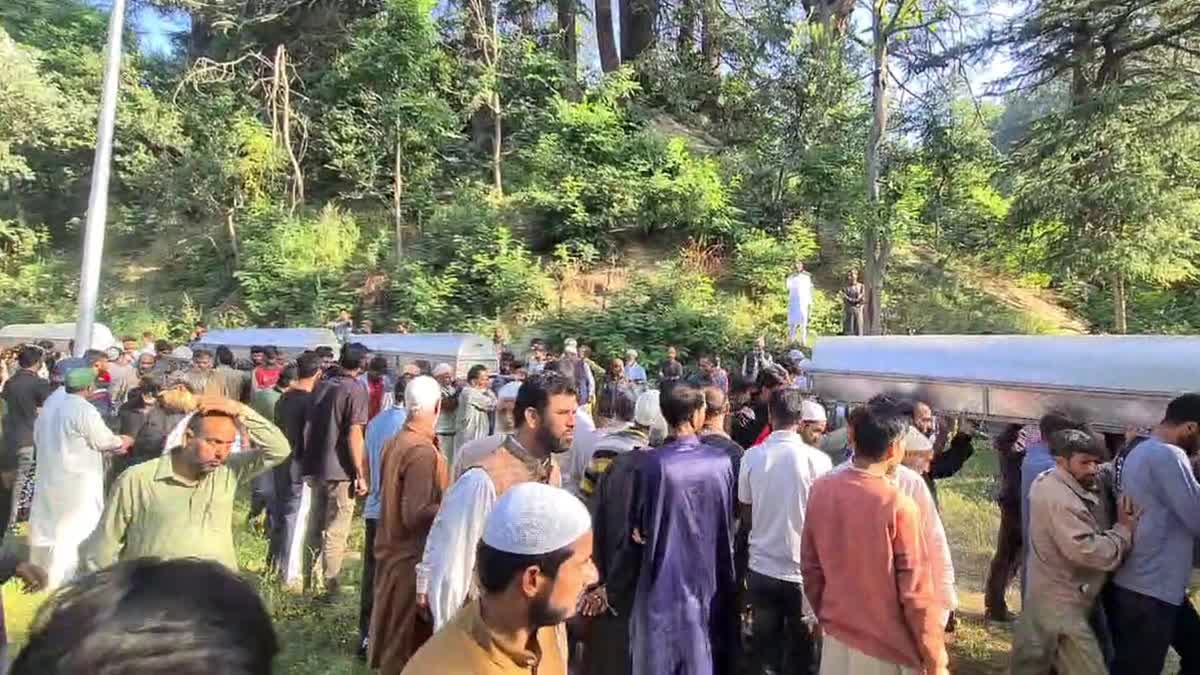 Locals attend the funeral of four family members killed in accident while fetching drinking water in Jammu and Kashmir's Kupwara