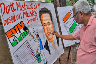 An Art teacher makes a painting questioning the statement of Tesla CEO Elon Musk on eliminating EVM machines, in Mumbai on June 19, 2024.