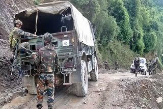 Security personnel conduct a search operation, where an army convoy was attacked by terrorists in the Machedi area, in Kathua on Tuesday.