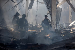 Emergency workers search for victims after a Russian missile hit a supermarket in Kostiantynivka, Donetsk region, Ukraine on August 9.