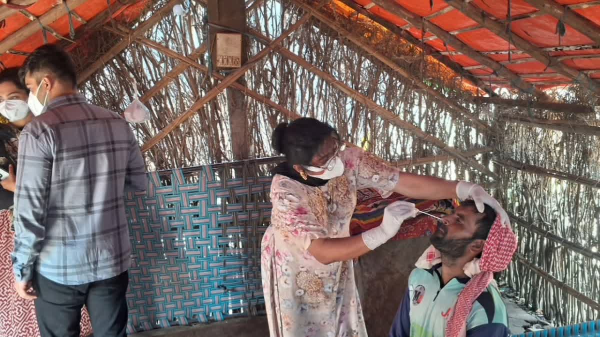 A health official tests a local in Kutch district of Gujarat amid mysterious disease outbreak