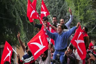 National Conference supporters celebrate the victory in Srinagar