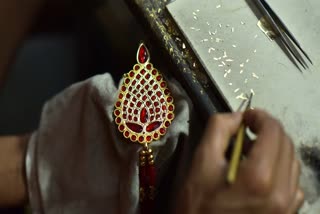 Jewellers are manufacturing Assamese traditional jewelry at Doogdoogi Jewellery workshop ahead of Rongali Bihu in Ranthali village, Nagaon district, Assam, India, on April 8, 2024.