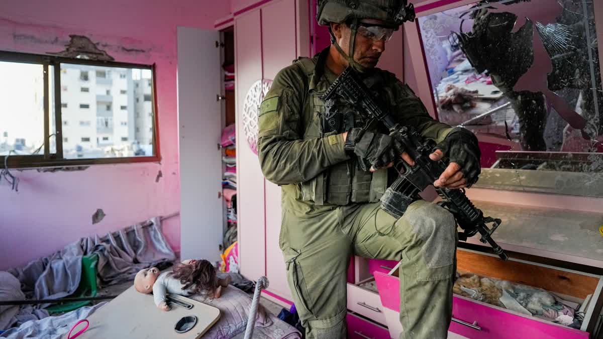 An Israeli soldier stands in an apartment during a ground operation in the Gaza Strip, Wednesday, Nov. 8, 2023.  (AP)