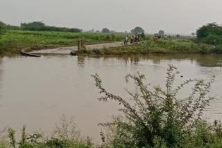 Man_Washed_Away_in_Flood_Water_in_Bapatla_District