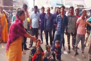 Woman sitting on Dharna with children