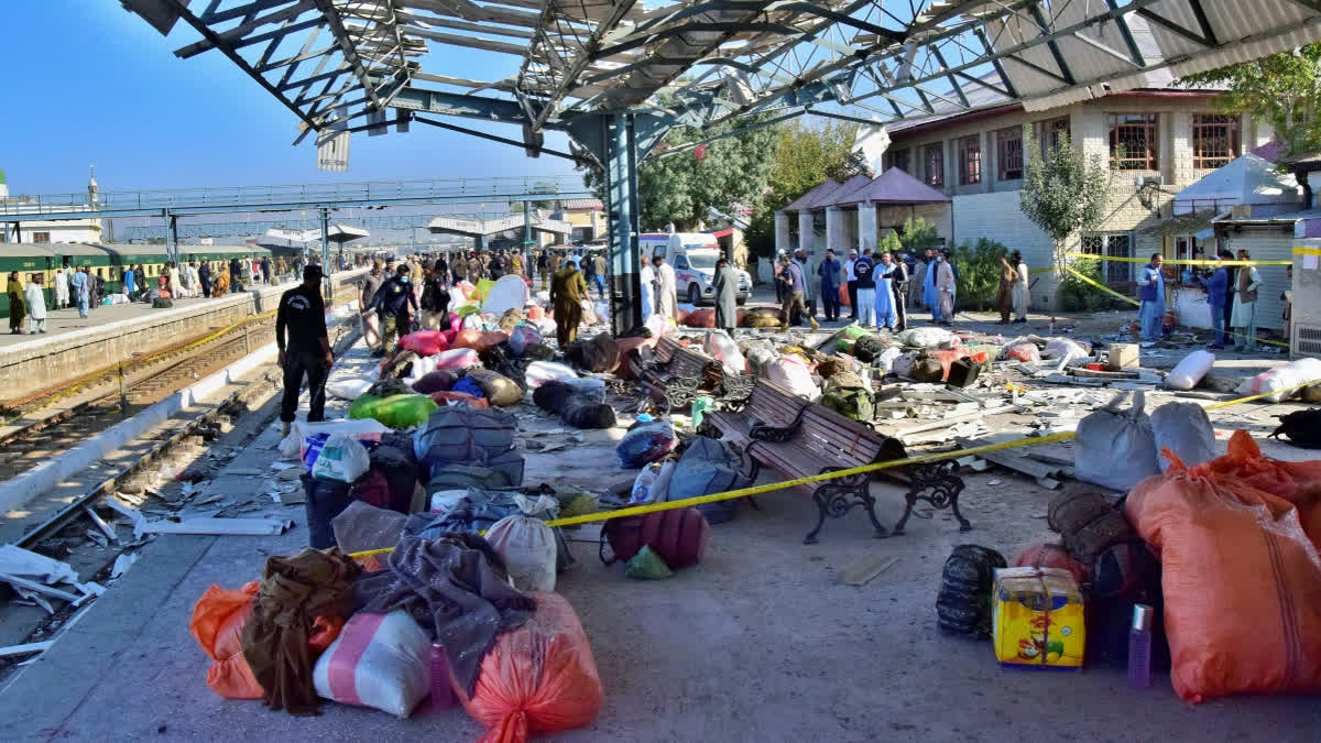 Security officials examine the site of a bomb explosion at railway station in Quetta, southwestern Pakistan, Saturday, Nov. 9, 2024.