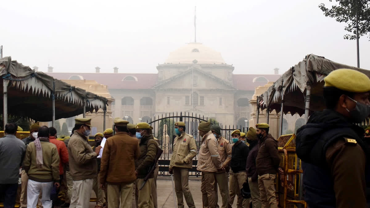 Police personnel stand guard outside closed Allahabad High Court in Prayagraj on Tuesday.