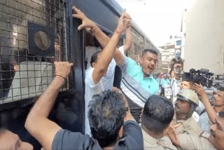 MES workers being put into the prison van after detention