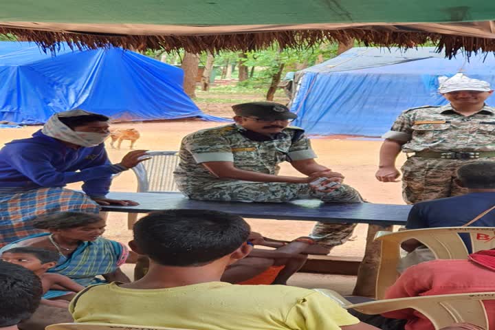 Inspector General of Police P Sundararaj talking to villagers