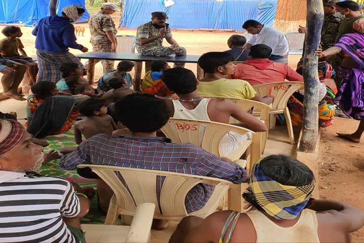 SP-Collector discussing with villagers