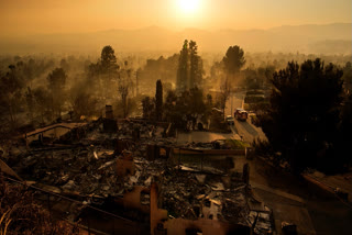 An emergency vehicle drives through a neighborhood devastated by the Eaton Fire, Thursday, Jan. 9, 2025, in Altadena, Calif.