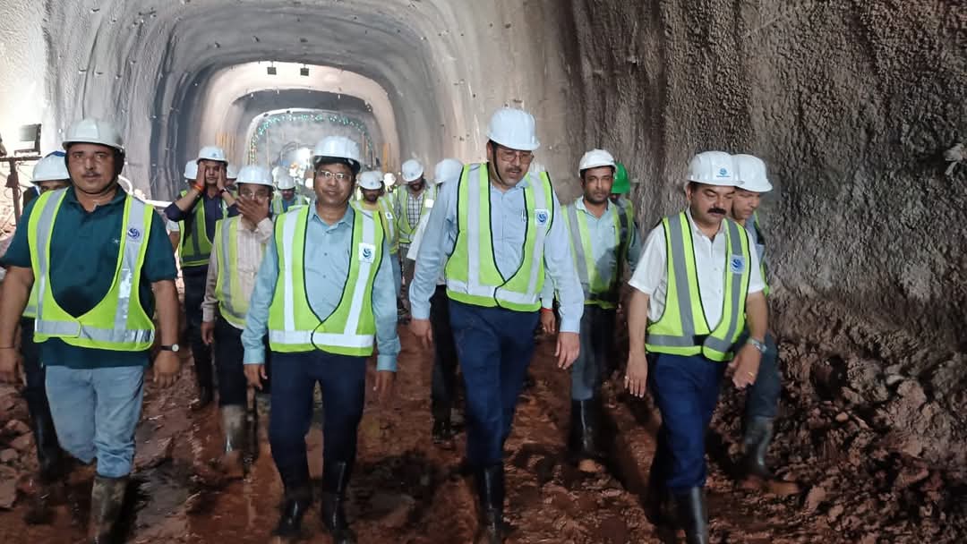 Officers and employees inspecting the tunnel