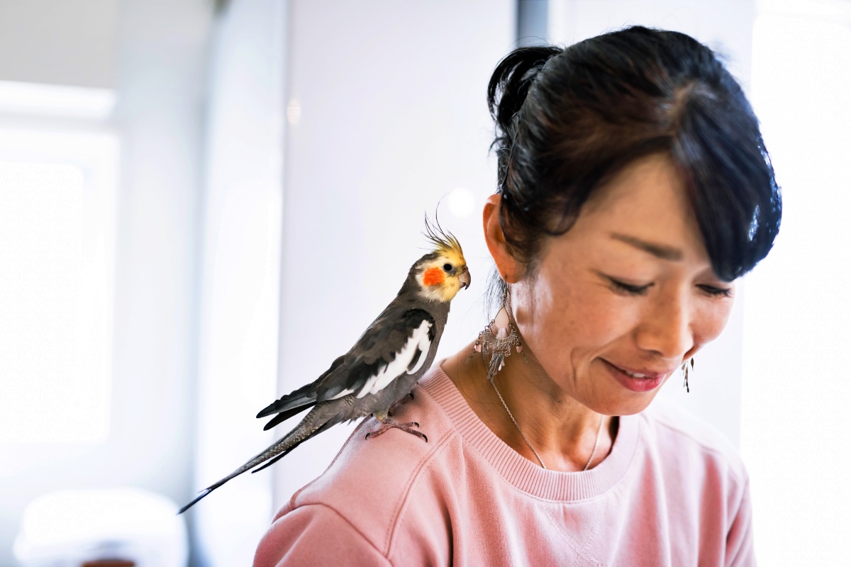 Woman with pet bird