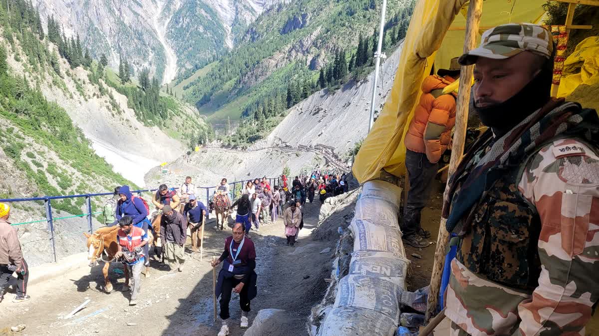 Pilgrims on their way for the Amarnath Yatra, on Sunday.