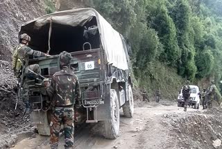 Security personnel conduct a search operation, where an army convoy was attacked by terrorists in the Machedi area, in Kathua on Tuesday.