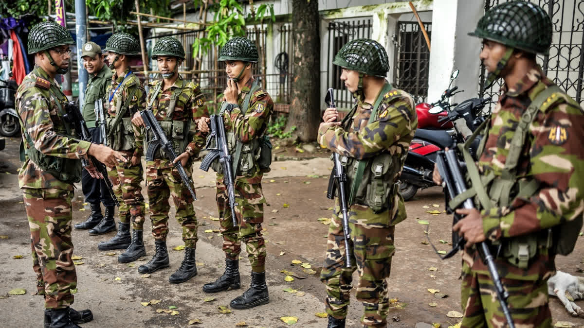 Bangladeshi military personnel stand guard at an empty police station in Dhaka on August 9, 2024.