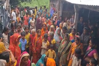 Locals gather outside the house where assailants carried out a triple murder in Bihar's Begusarai on Saturday, Aug 10, 2024