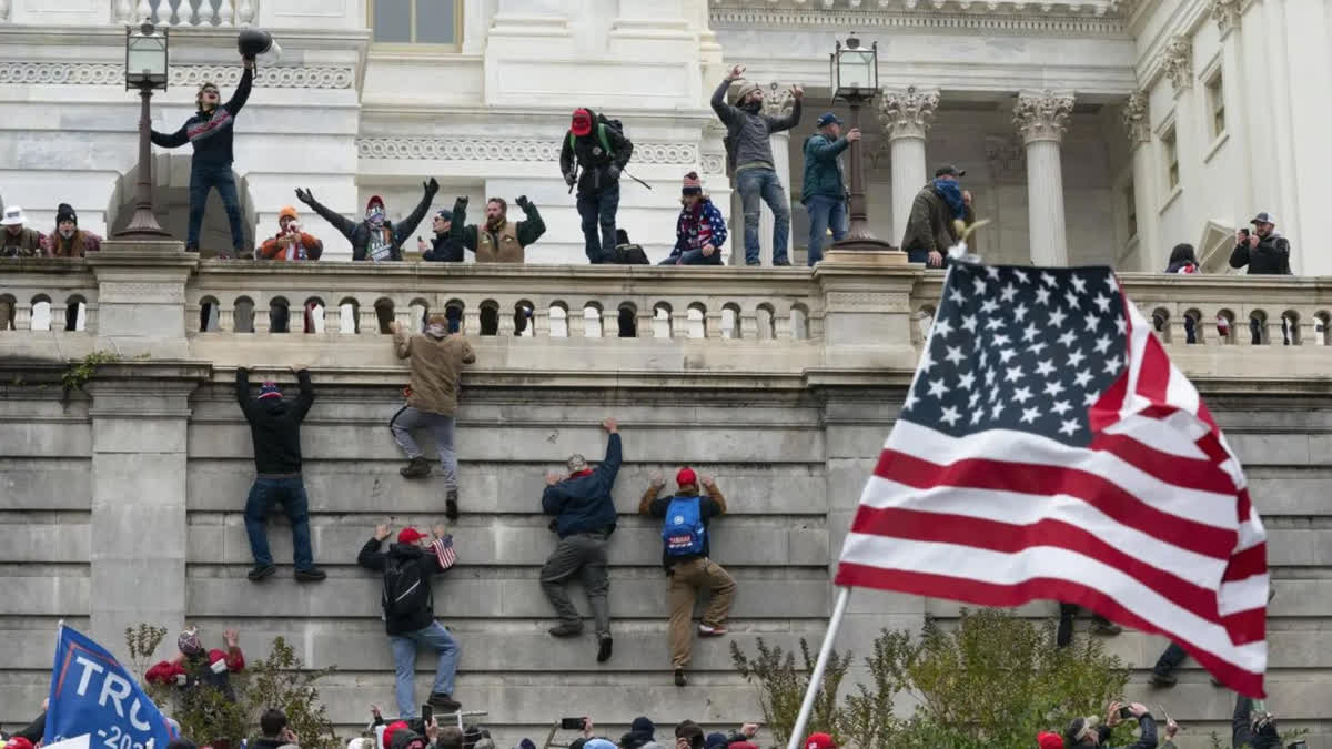 Several men accused of assaulting offers with flag pole, wasp spray during US Capitol riot