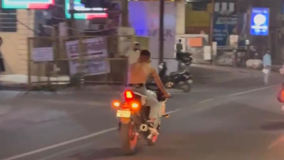 HALF NAKED YOUTH BIKE STUNT