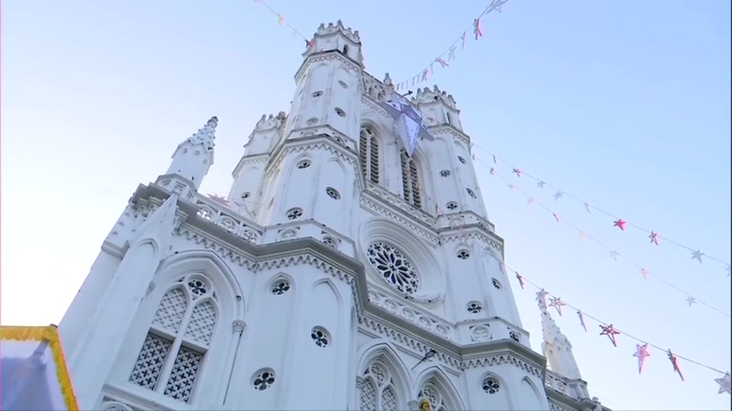 Devotees gather for Christmas prayers at a churches in India