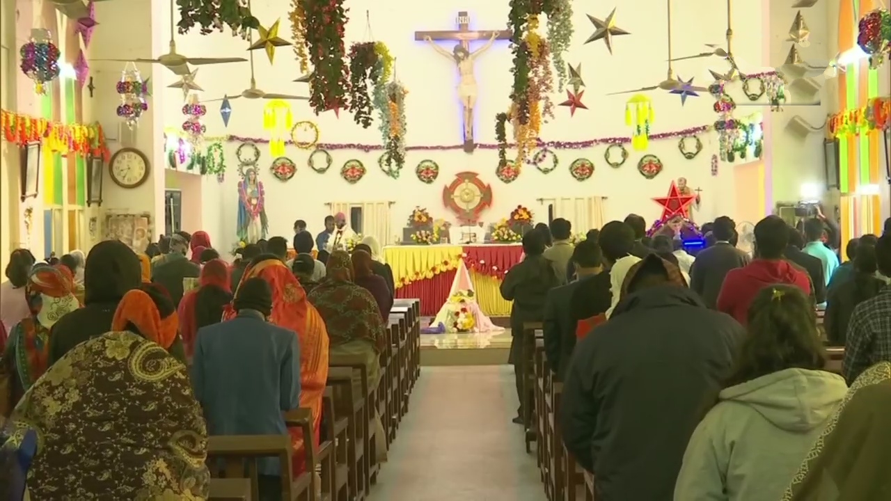 Devotees gather for Christmas prayers at a churches in India