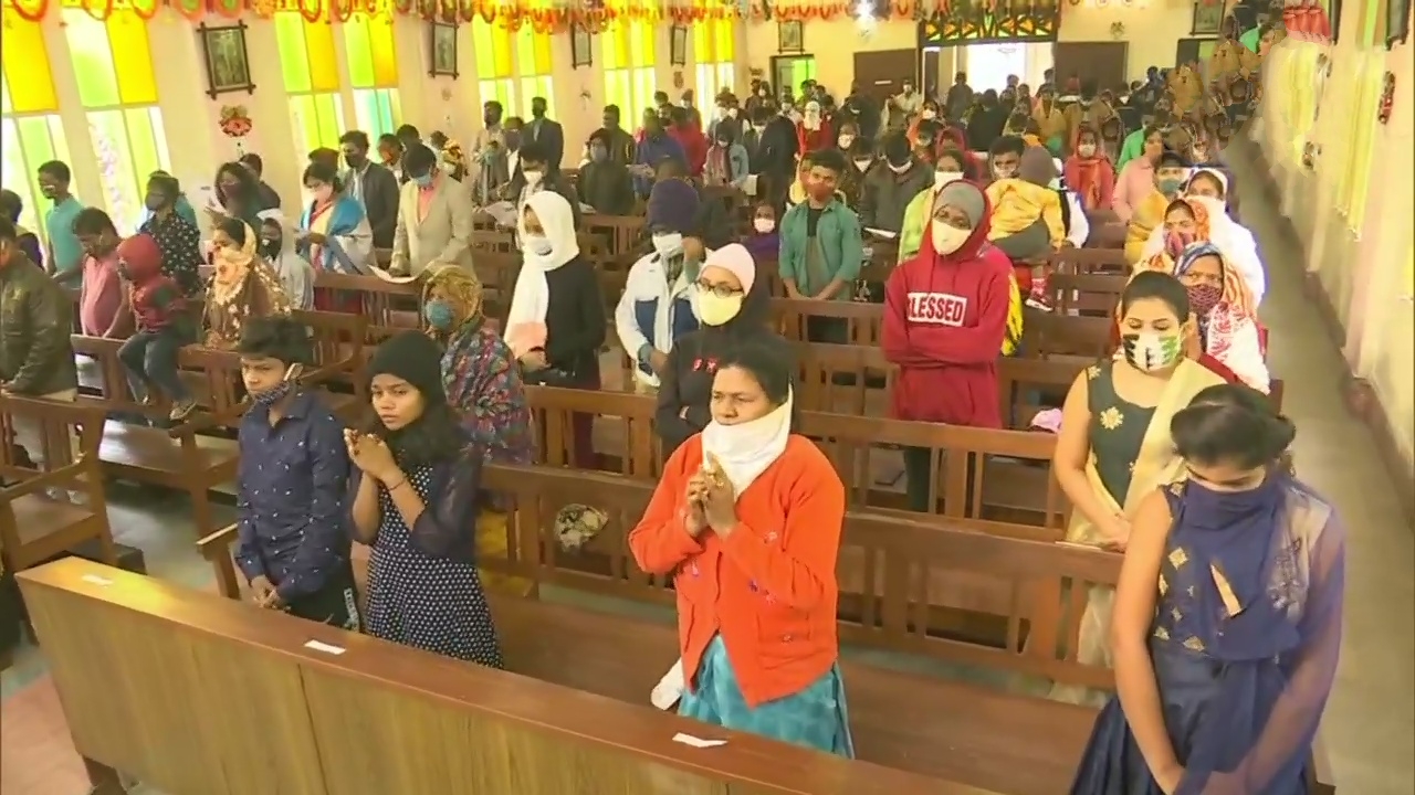 Devotees gather for Christmas prayers at a churches in India