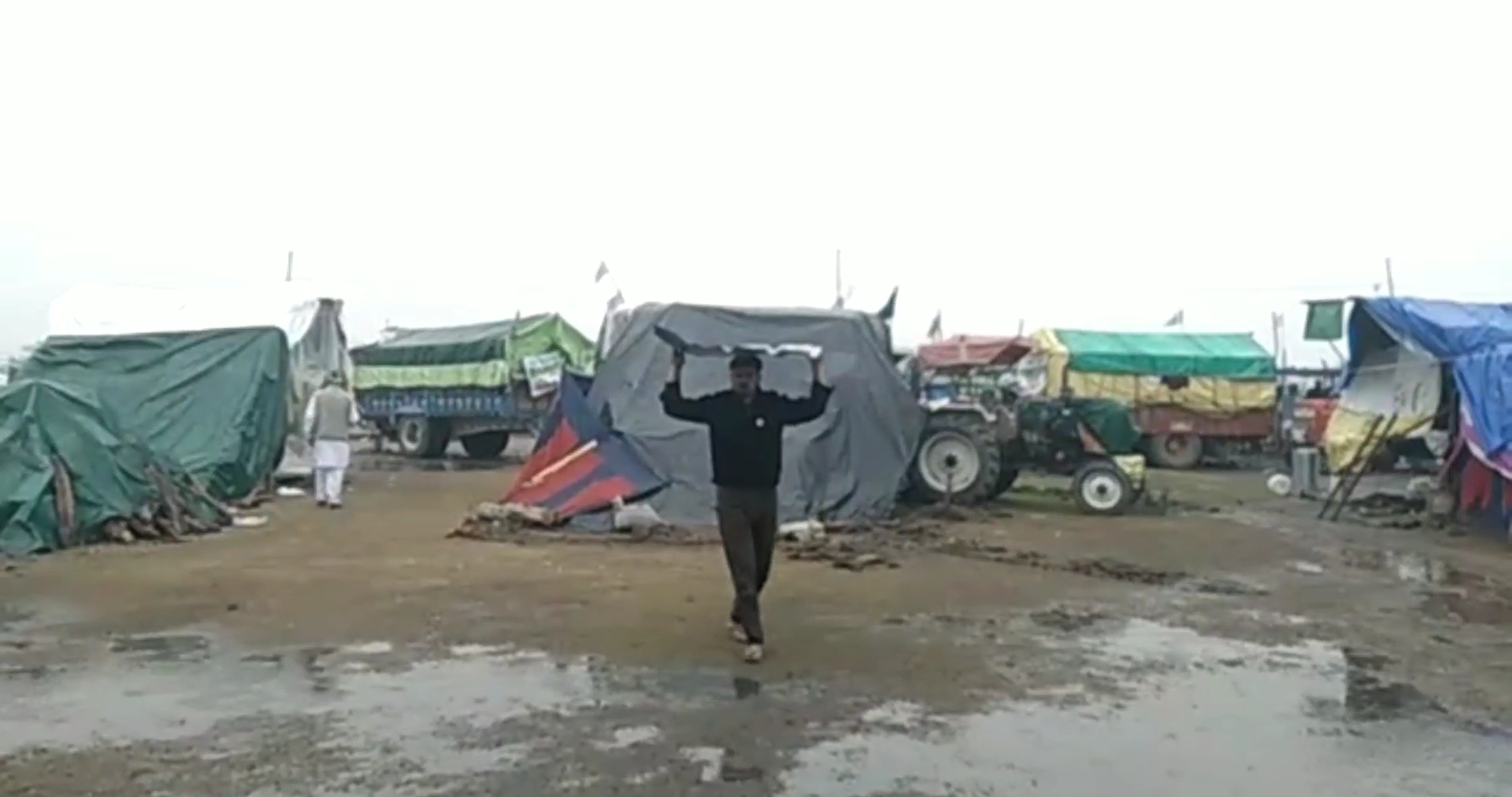 Undeterred by cold weather, rains, protesting farmers threaten to intensify stir further