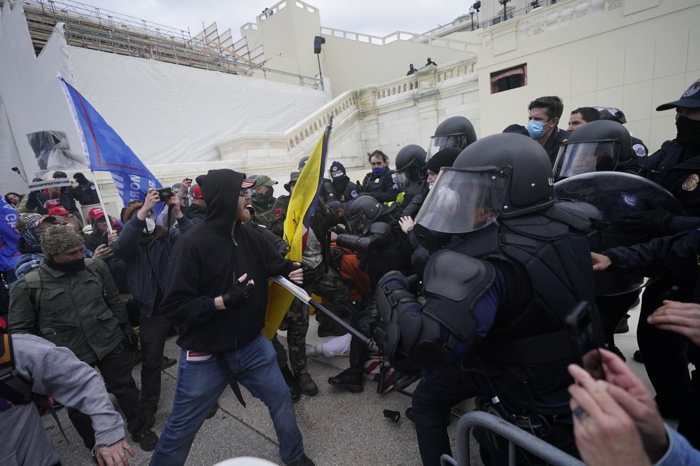 Trump supporters try to break through a police barrier, Wednesday, Jan. 6, 2021, at the Capitol in Washington.