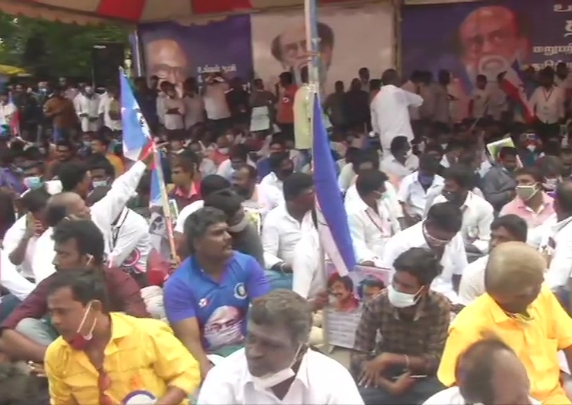 Members of Rajinikanth's fan club stage demonstration at Valluvar Kottam in Chennai