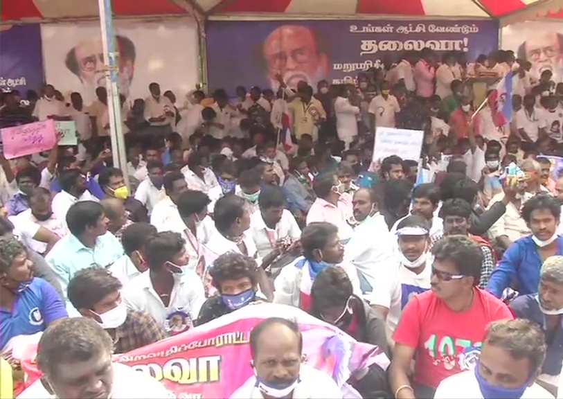 Members of Rajinikanth's fan club stage demonstration at Valluvar Kottam in Chennai