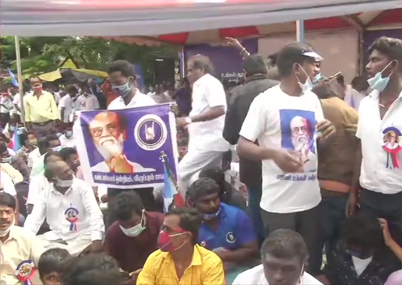 Members of Rajinikanth's fan club stage demonstration at Valluvar Kottam in Chennai