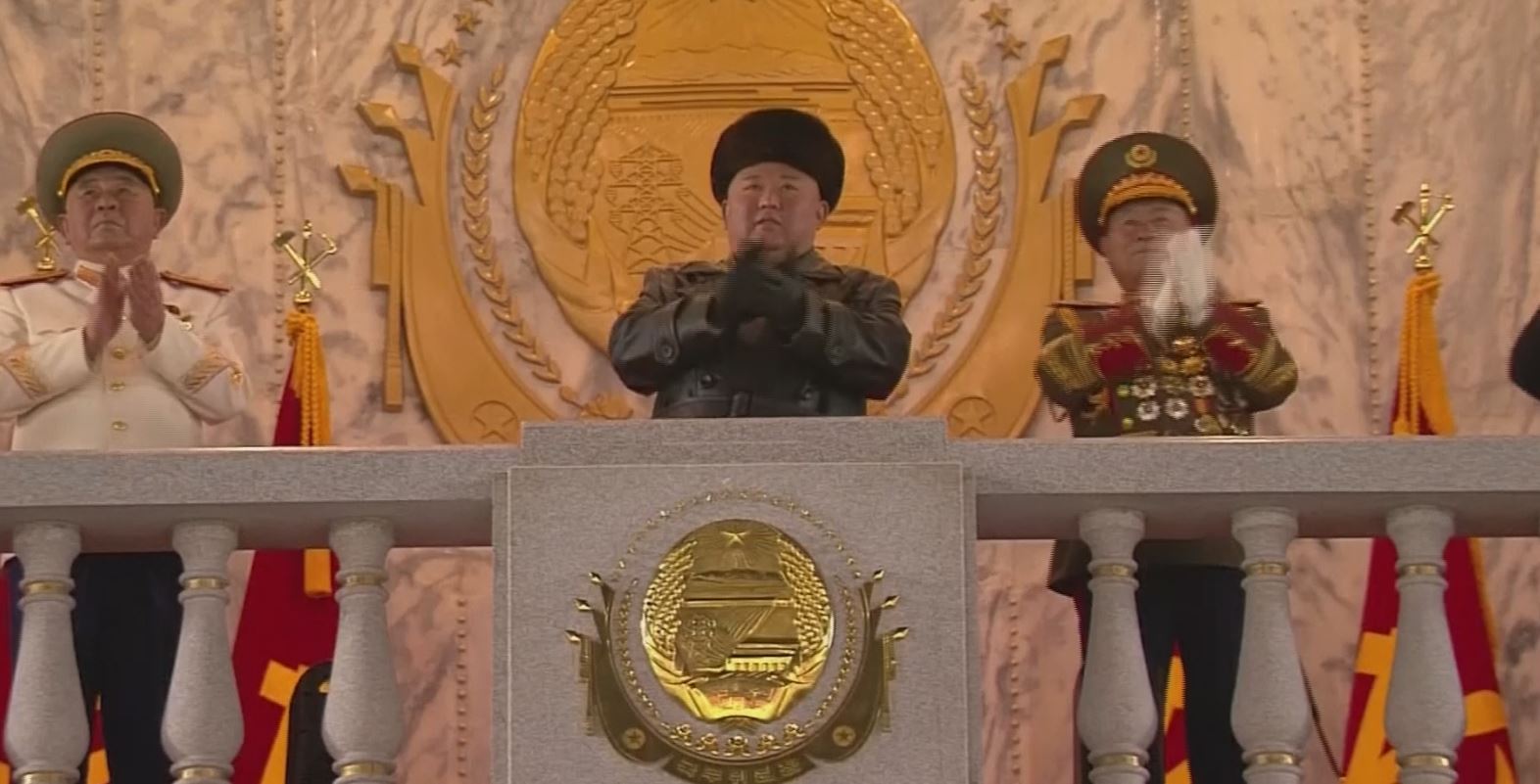 north korea holds huge military parade,vows nuclear might