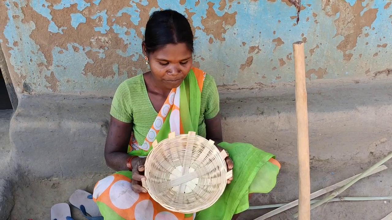 woman making goods from bamboo