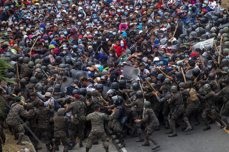 Guatemalan police and soldiers launched tear gas and wielded batons and shields against a group of Honduran migrants that tried to push through their roadblock early Sunday